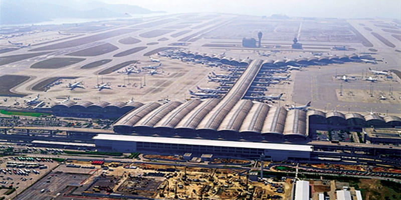 An aerial view of the Hong Kong International Airport Terminal Building and runways.