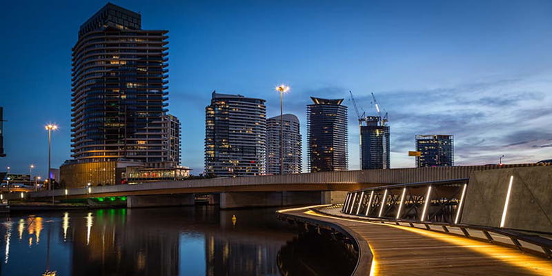 Night time on he Yarra River overlooking the Jim Stynes Bridge. Image courtesy of Cox Architecture.