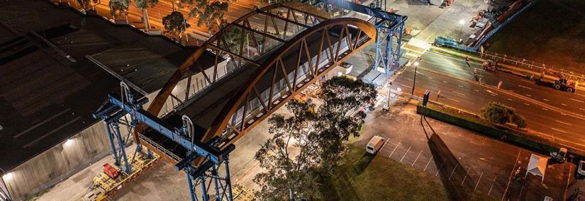 A brand-new steel arch bridge was successfully installed across James Ruse Drive in Rosehill in May 2021 as part of the Parramatta Light Rail project.