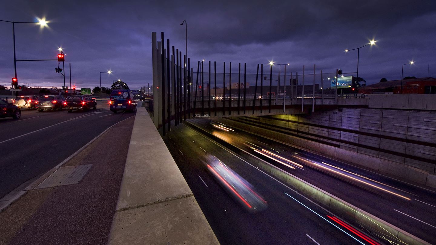 Torrens Road to Torrens River Project at night.